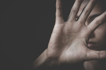 woman raised her hand for dissuade, campaign stop violence against women.