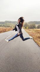 child jumping on the road