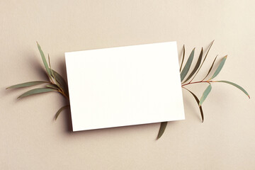 Greeting card or invitation mockup with green eucalyptus twigs