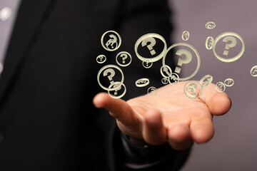 Businessman solving problem with digital question marks 3D rendering