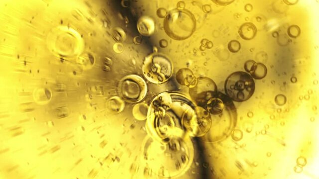 Gold bubbles of various sizes spinning clockwise in liquid. 