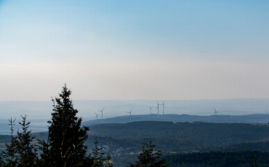 Fototapeta na wymiar Wind turbines between the hills in the landscape. View from Feldberg Hochtaunus. 