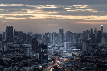 Bangkok, Thailand - Aug 04, 2021: Aerial view of Beautiful scenery view of Skyscraper Evening time Sunset creates relaxing feeling for the rest of the day. Selective focus.