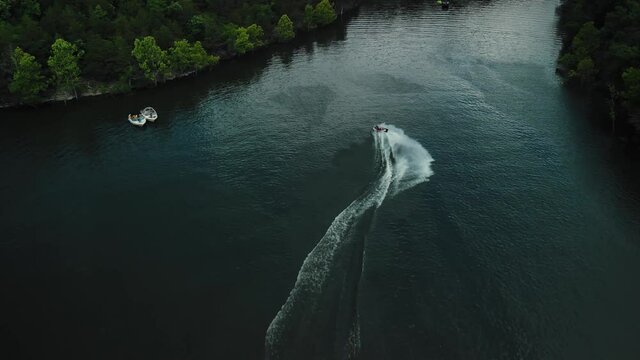 Aerial photography is an epic shot of jet ski racing on a large river. High quality 4k footage