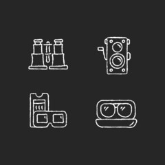 Obraz premium Authentic vintage chalk white icons set on dark background. Collectible binoculars. Old photo camera. Retro movie theater. Aviator sunglasses. Isolated vector chalkboard illustrations on black