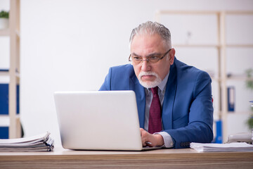 Old male employee and too much work in the office