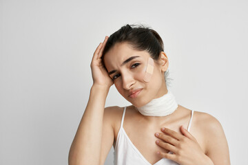 woman with head pain bandage around her neck health problems migraine