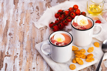 Spanish salmorejo cream soup with ham and egg