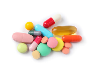 Heap of different colorful pills isolated on white, top view