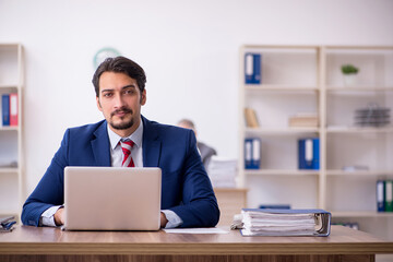 Two male employees working in the office