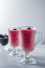 Banana-blackberry smoothie made from frozen fruits.