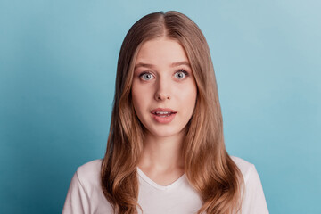 Portrait of shocked dreamy young lady look camera open mouth omg reaction on blue background
