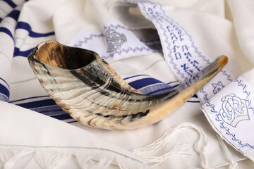 Shofar on tallit with text Blessed Are You, Lord Our God, King Of The Universe,