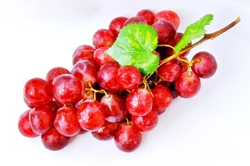 big bunch of red grapes isolated on white background