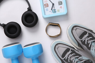 Fitness accessories on a gray background. Sports background. Top view. Flat lay