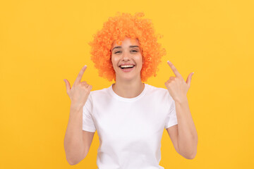 girls birthday party. happy funny woman in curly wig. express positive emotions.