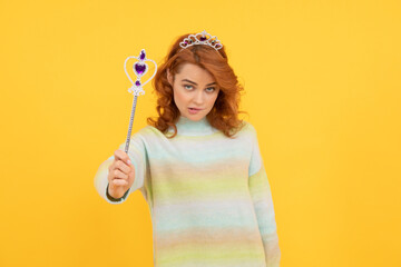 redhead woman in queen crown with magic wand, magic