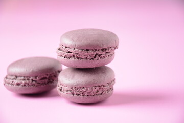 Colorful macarons cakes. Small French cakes. Sweet and colorful french macaroons, colorful almond cookies, pastel colors