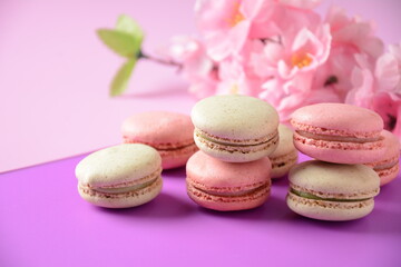 Colorful macarons cakes. Small French cakes. Sweet and colorful french macaroons, colorful almond cookies, pastel colors