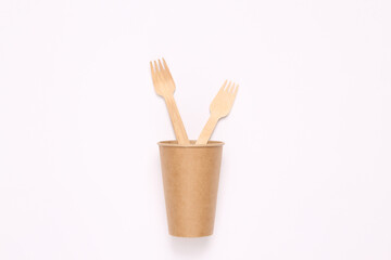 Plastic free wooden forks in cup. Zero waste, eco friendly concept. Flat lay.