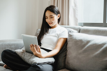young female business woman work at home with tablet or laptop computer, using online communication technology, asian people in happy lifestyle, beautiful girl person stay at home