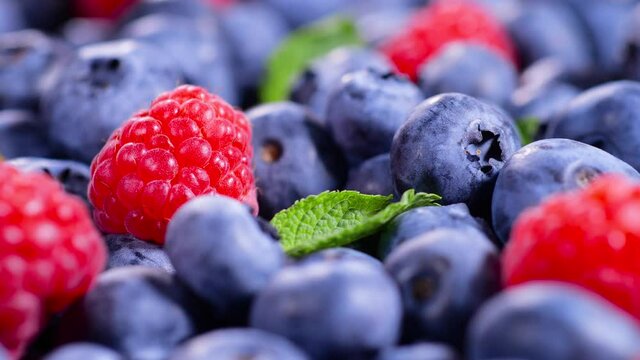 Berries, Various colorful background, Juicy Ripe Summer berries. Mint leaves, Raspberry, Blueberry close-up