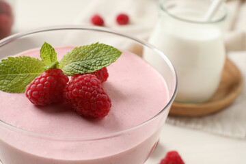 Glass of delicious raspberry mousse with mint, closeup