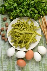 egg noodles with parsley - traditional Italian recipe - closeup