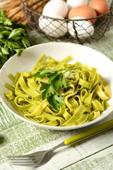 egg noodles with parsley - traditional Italian recipe - closeup