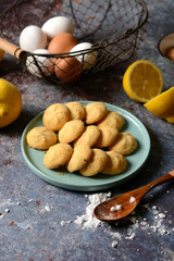 egg cookies with lemon cream - ingredients around - closeup