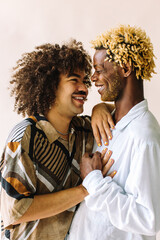 Beautiful gay couple being romantic in a studio