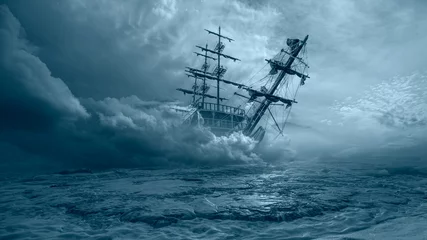 Fotobehang Een oud zeilschip in de mist vaart naar de rotsen - Zeilend oud schip in een stormzee op de achtergrond stormachtige wolken © muratart