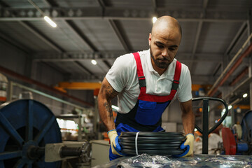 Portrait of african american male handyman working in an industrial factory