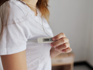 Woman in white t-shirt joyfully armpit temperature health