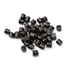 Heap of black Bay Leaf Licorice pieces isolated on white background  