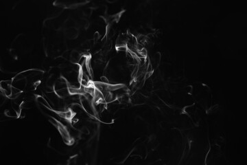 Smoke, clouds in a black background.
