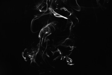 Smoke, clouds in a black background.