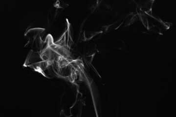 Smoke, clouds in a black background.