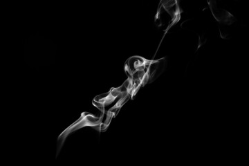 Smoke, clouds in a black background.