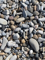 Pebbles or stones on the beach. 