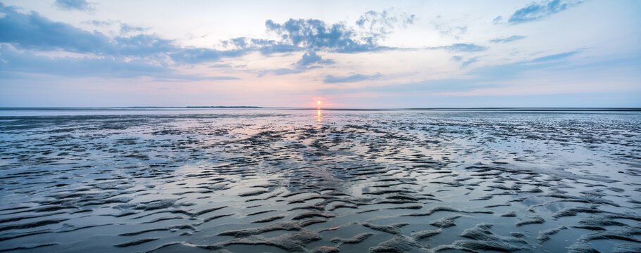 Wadden Sea panorama at sunset during low tide