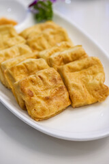 A delicious Chinese dish, deep-fried tofu with milk