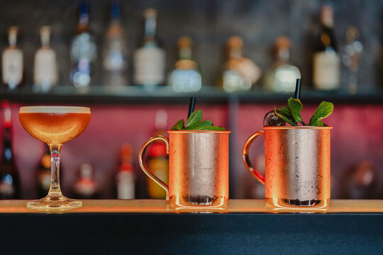 Assorted alcohol cocktails served on counter in bar