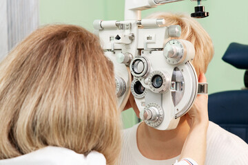 Checking the retina of a female eye close up. Patient in the ophthalmology clinic