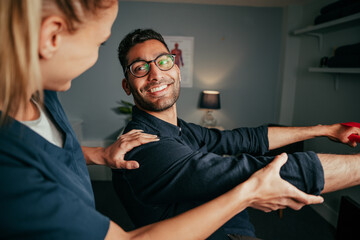 Mixed race male patient practising rehabilitation exercises