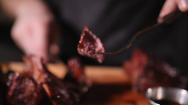 juicy piece of beef ready-made steak on a fork