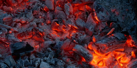 Obraz na płótnie Canvas Background of the embers in a campfire or fireplace.