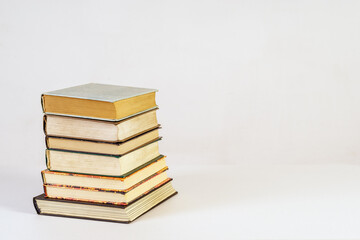 Stack of old books on white background