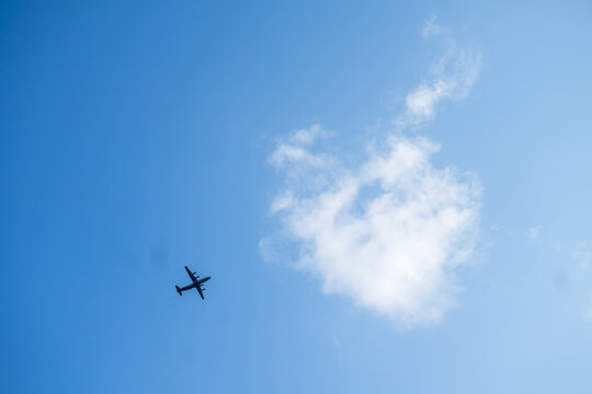 Flying passenger plane on blue sky background