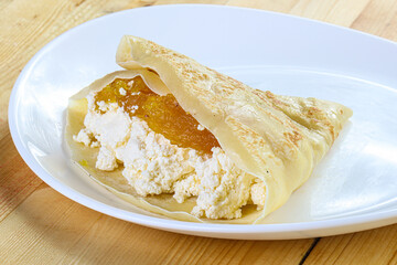 Pancake with cottage cheese and jam